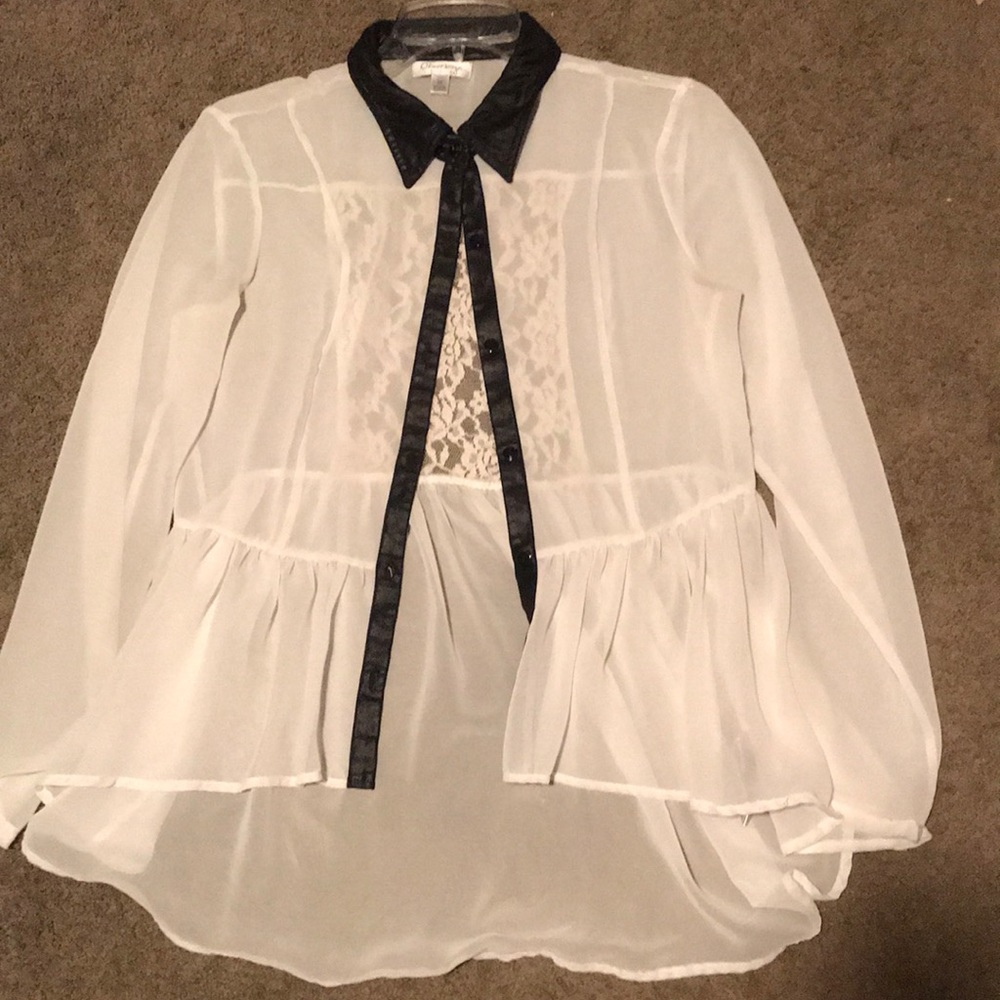 A white collar button-up blouse